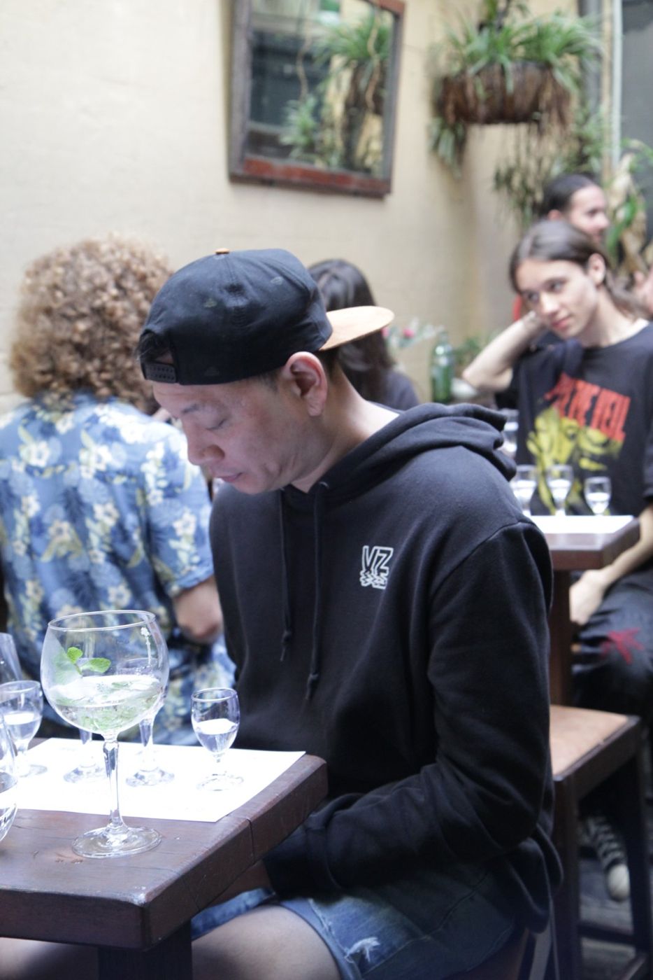 Guests tasting gin in a courtyard